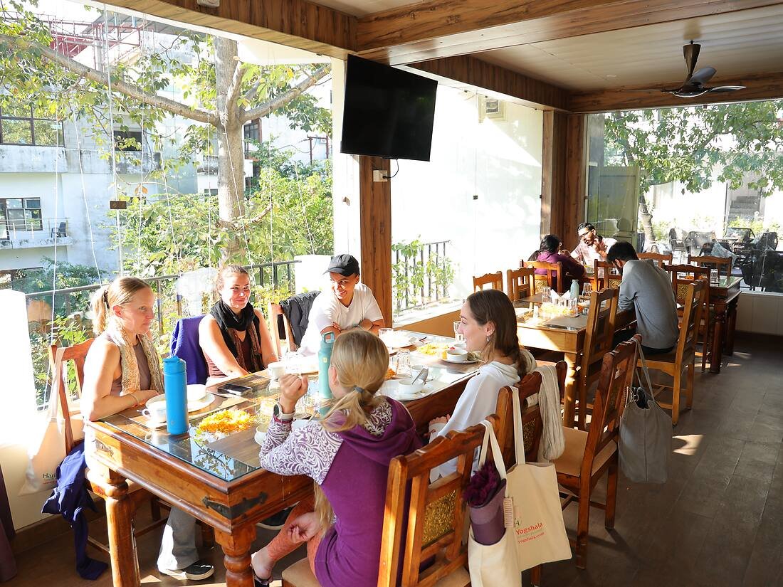 Students enjoying a sattvic meal together at Haritha Yogshala